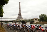 The peleton rides past the Eiffel Tower during the final 97th Tour de France.
