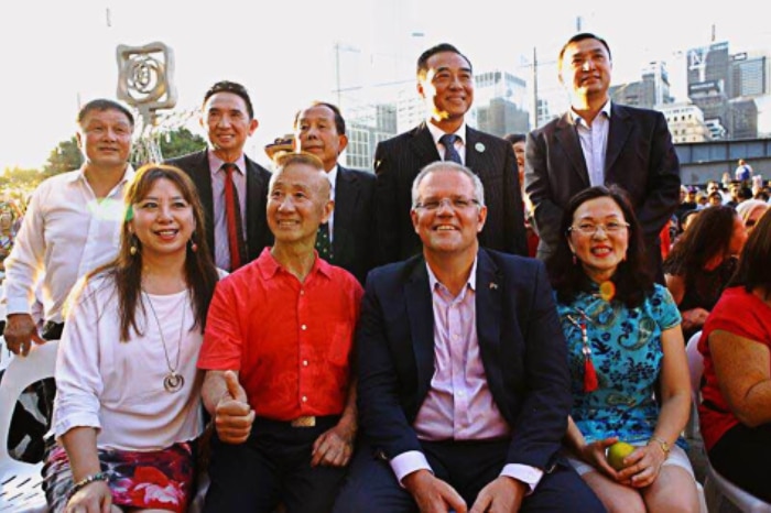 Scott Morrison and Gladys Liu pose for a photo with a group of people at Lunar New Year celebrations