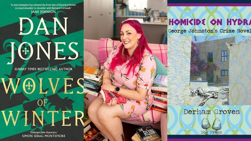 a woman with pink hair surrounded by books, smiling at the camera, between 2 book covers