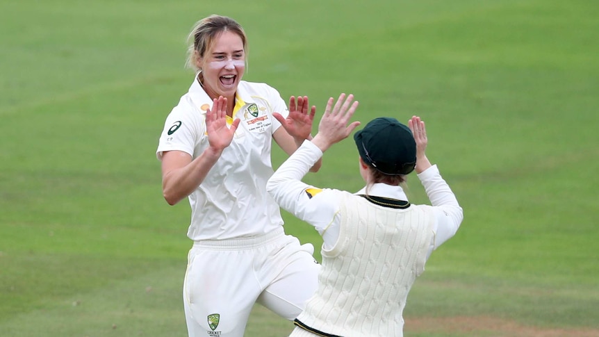 Australia bowler Ellyse Perry shouts as she prepares to slap hands with a teammate during the Women's Ashes Test against England