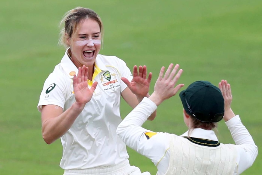 Australia bowler Ellyse Perry shouts as she prepares to slap hands with a teammate during the Women's Ashes Test against England