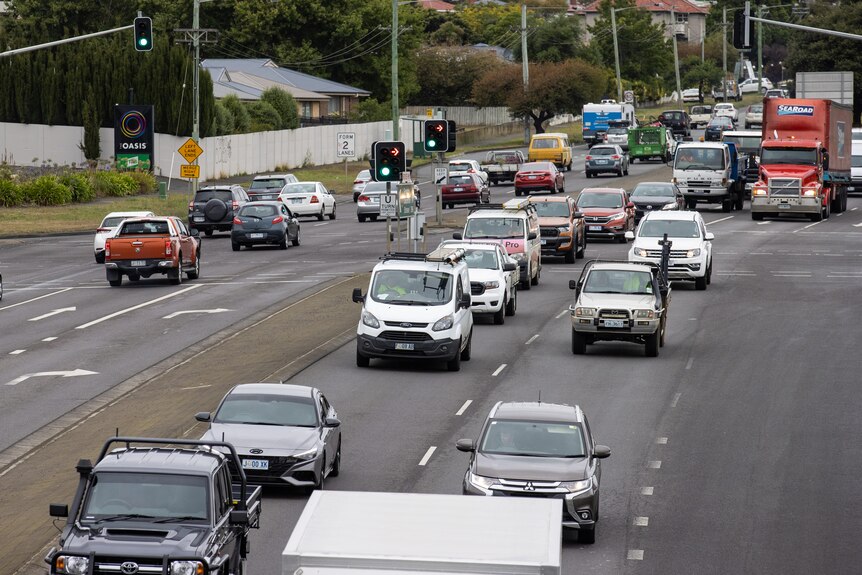 Several lanes of traffic driving in both directions on the highway in Hobart, TAS, March 2022