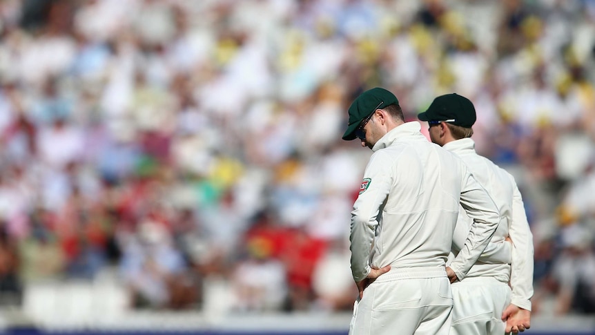One of those days ... Michael Clarke gathers his thoughts while fielding against England