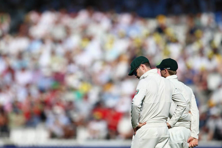 One of those days ... Michael Clarke gathers his thoughts while fielding against England