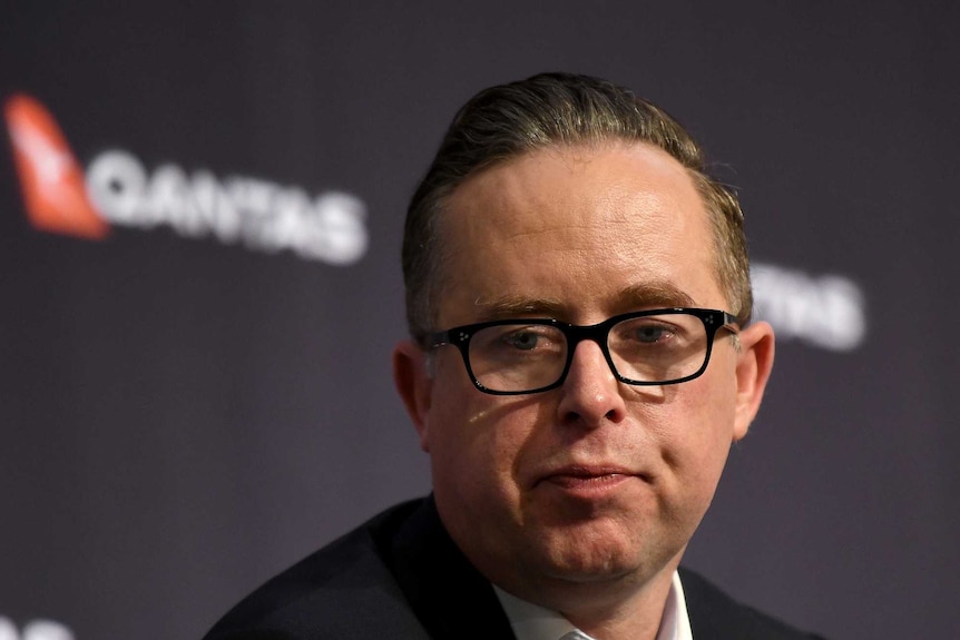 Qantas CEO Alan Joyce speaks to the media during a press conference.
