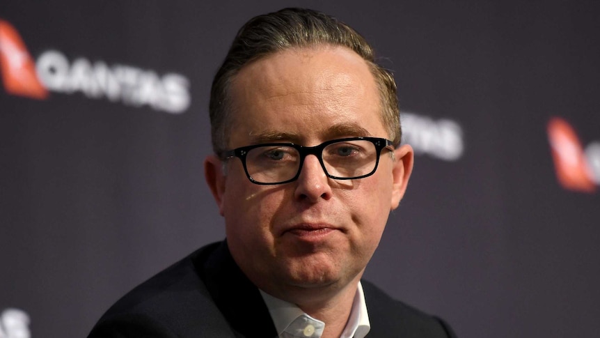 Qantas CEO Alan Joyce speaks to the media during a press conference.