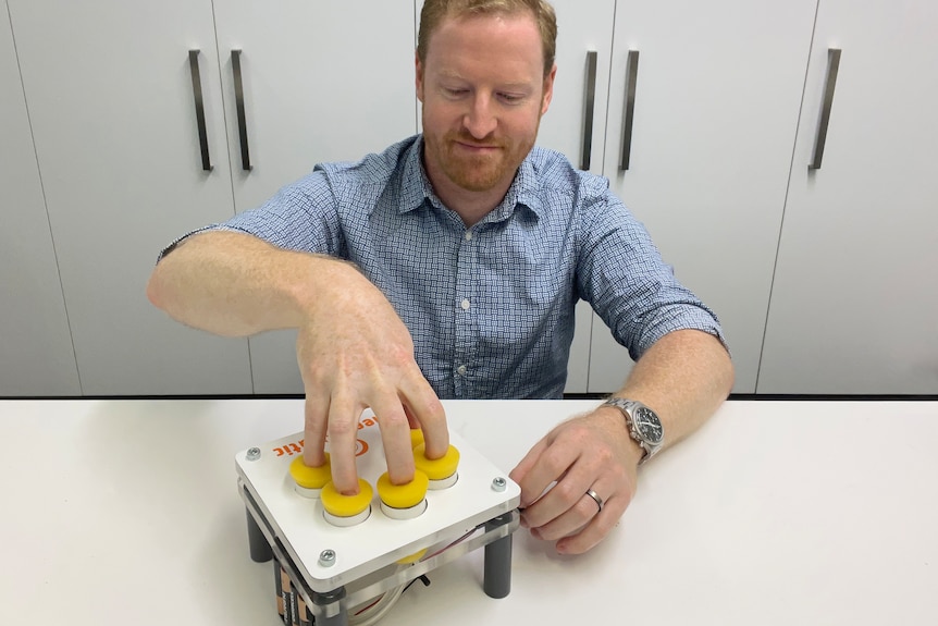Duncan Hellmers with his finger-cleaning invention