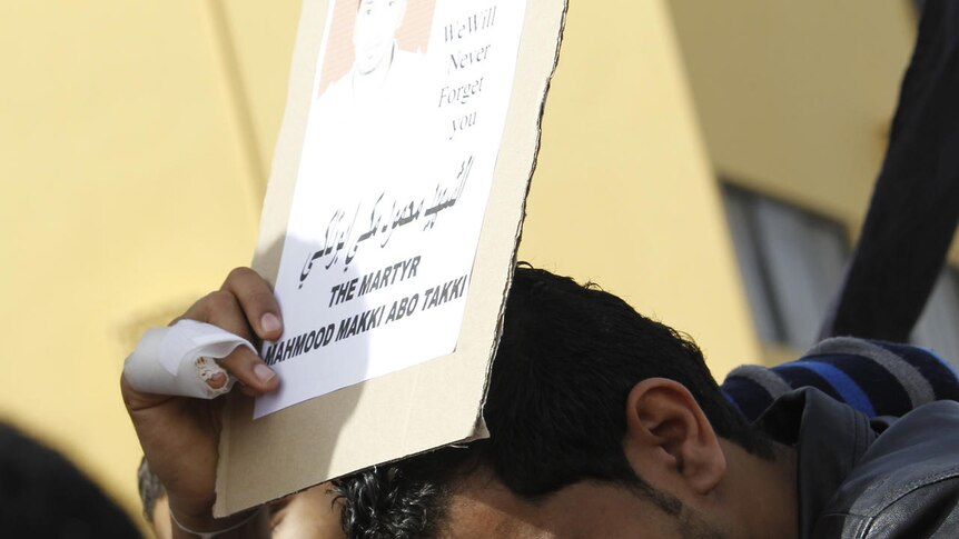 Mass mourning: a family member of a protester who was killed by riot police grieves in Sitra, Bahrain