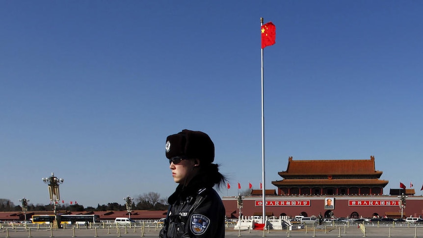 Policewomen ride segway-like vehicles on Tiananmen Square