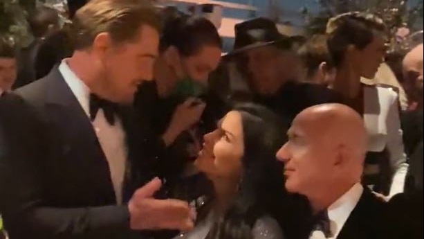 Leonardo DiCaprio, Lauren Sanchez and Jeff Bezos at an event.