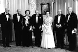 Queen Elizabeth II stands in the centre of UK Prime Ministers past and present.