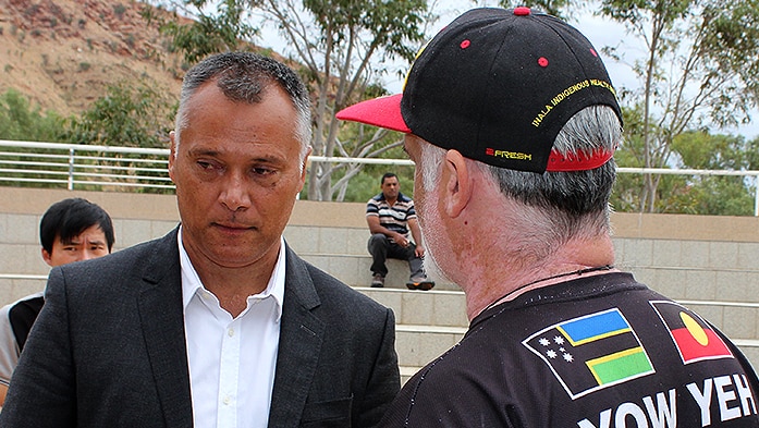 Dr Marcus Woolombi Waters talks with Stan Grant after a heated meeting in Alice Springs