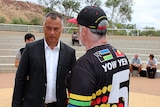 Dr Marcus Woolombi Waters talks with Stan Grant after a heated meeting in Alice Springs