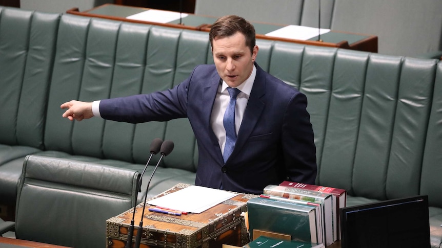 Hawke is standing at the despatch box, pointing with his right arm, mid speech.