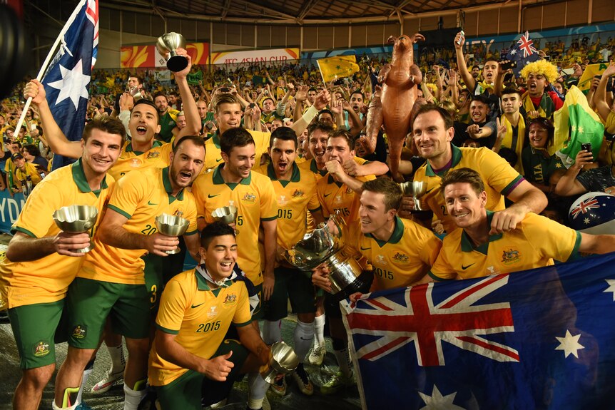 The Socceroos celebrate with the Asian Cup trophy after winning the final in 2015.