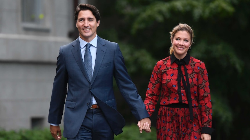 Prime Minister Justin Trudeau walks with Sophie Gregoire Trudeau.