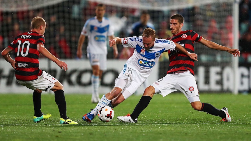 Melbourne Victory's Mitch Nichols controls the ball against the Western Sydney Wanderers.