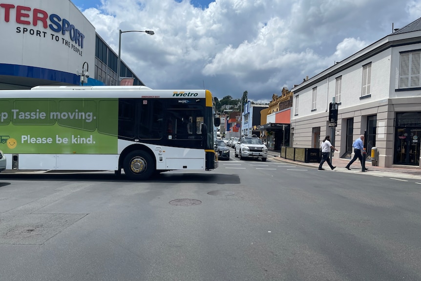 A bus drives across an intersection in Launceston.