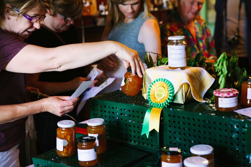 A woman checks the ingredients in the winning entries.