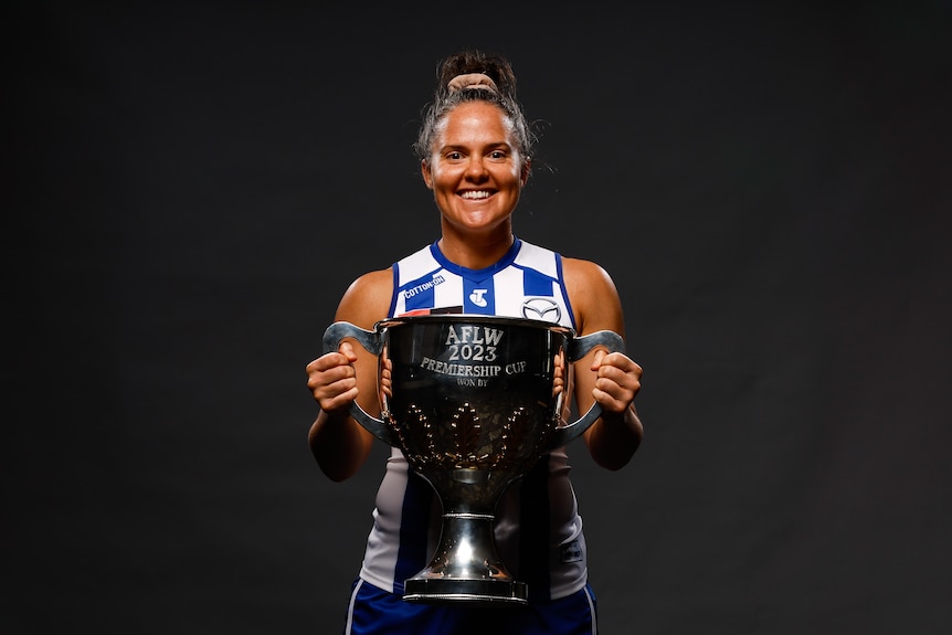 Emma Kearney of the Kangaroos poses with the AFLW Premiership trophy