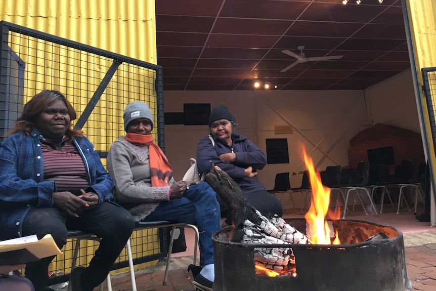 Lorrayne Gorey, Veronica Turner, and Magdalene Marshall sit outside the language centre