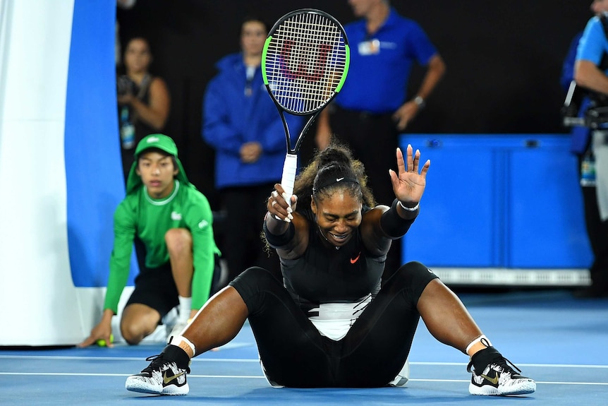 Serena Williams celebrates her win against sister Venus after match point.