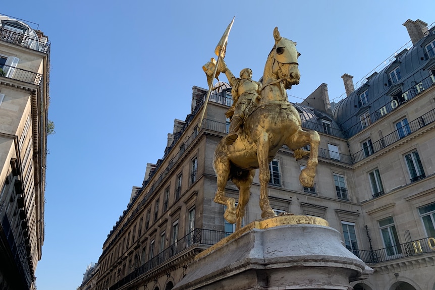 A statue of a woman on a horse.