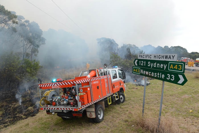 Rural Fire Service volunteers conducting back-burning in the Catherine Hill Bay area.