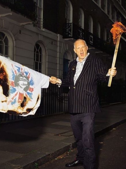 Joe Corre sets fire to a Sex Pistols shirt.