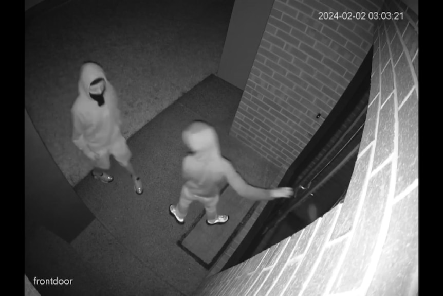 a photo of security camera vision with two people 
