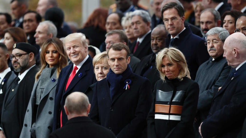 Donald Trump gives a big smile as Vladimir Putin arrives with world leaders in Paris