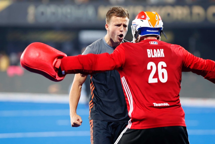 Dutch player Thijs van Dam (L) celebrates with Pirmin Blaak in the Hockey World Cup semi-final.