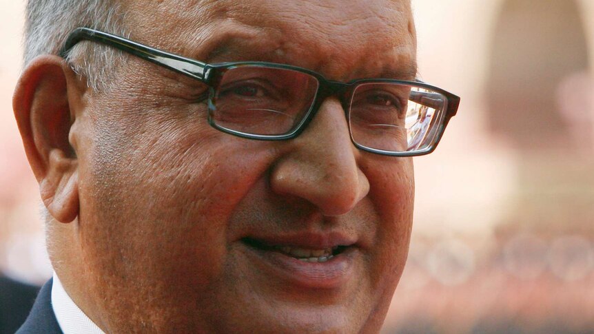 Tight shot of Anand Satyanand smiling.