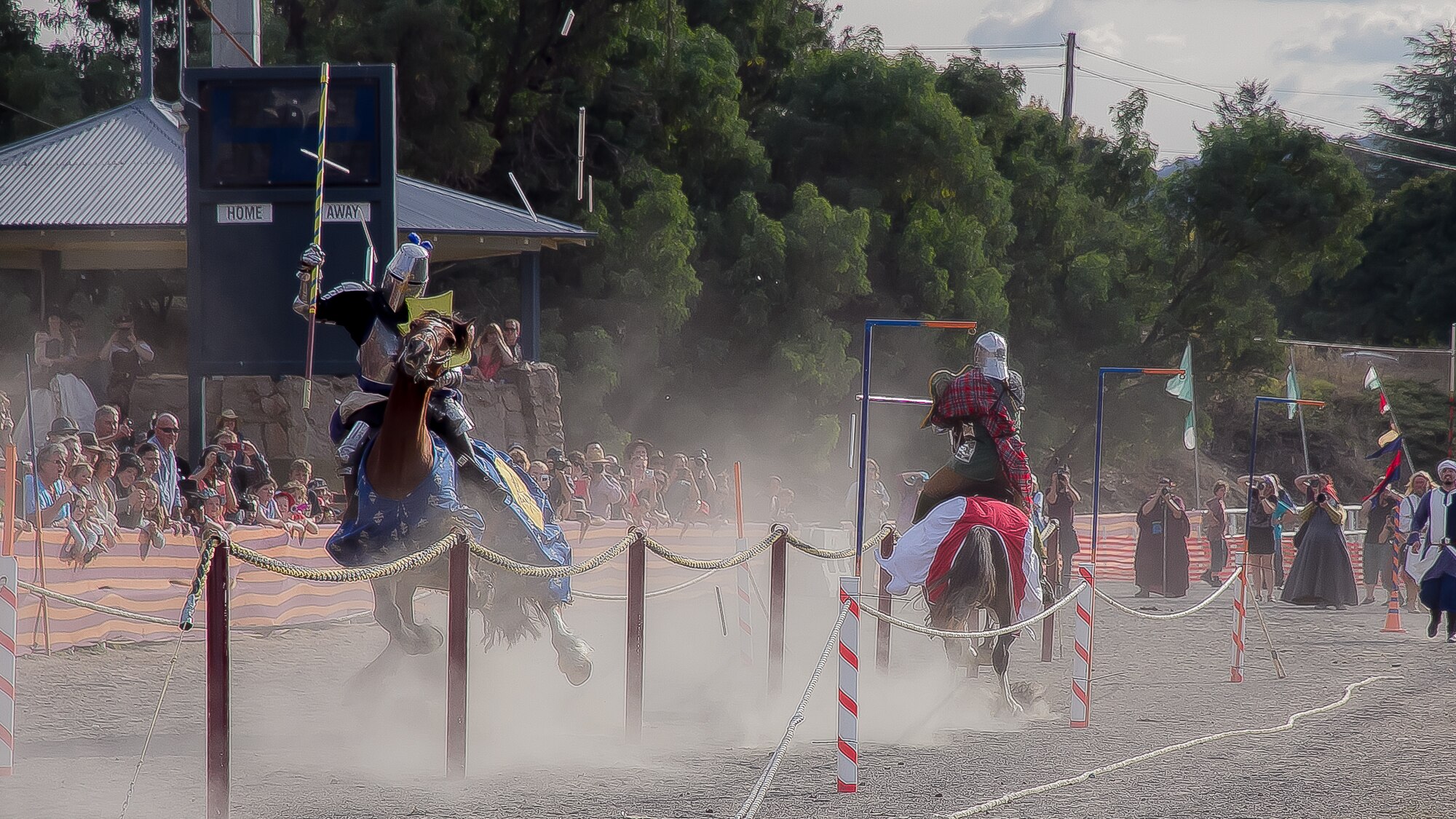 Two men on horses jousting