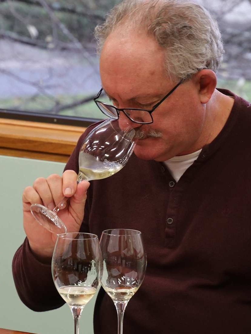 House of Arras winemaker Ed Carr tasting wine.