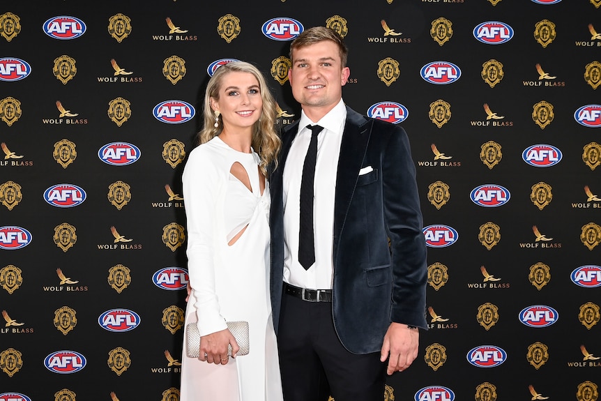 Port Adelaide star Ollie Wines and his partner Olivia May in a white dress at the Brownlow Medal. 