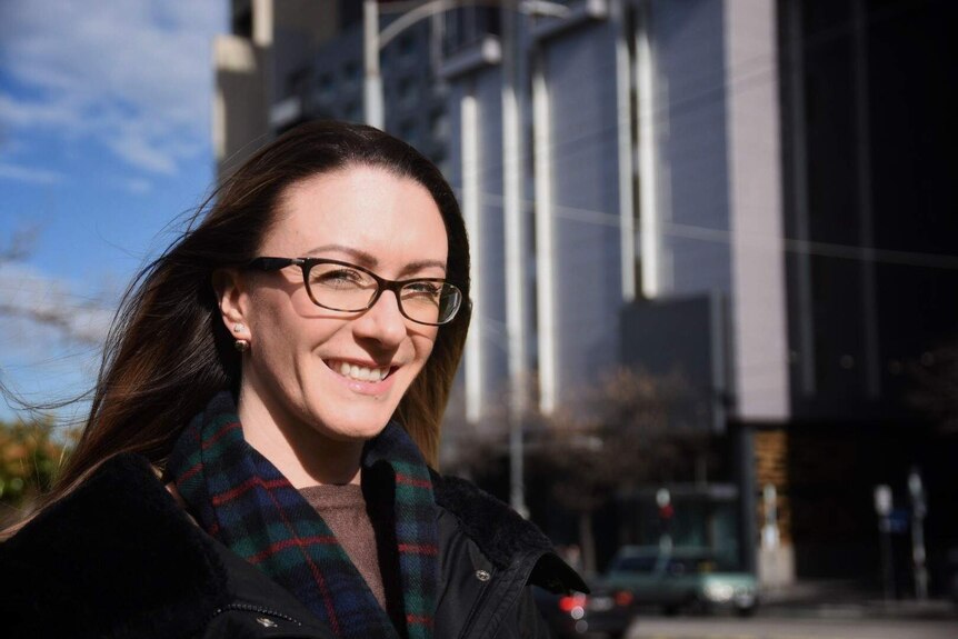 Planning Institute of Australia Victorian president Laura Murray stands outside.