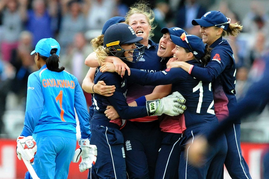 Anya Shrubsole hugs her teammates as England wins Women's World Cup