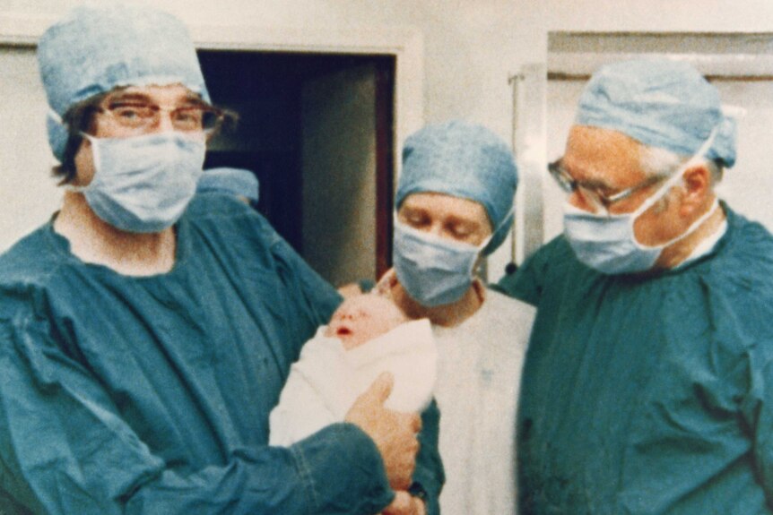 Baby Louise Brown held by Professor Robert Edwards with her mother and Professor Patrick Steptoe