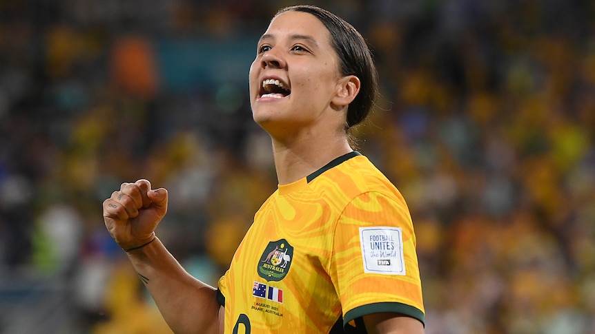 Sam Kerr pumps her right fist as she looks to the crowd after the Matildas defeated France.