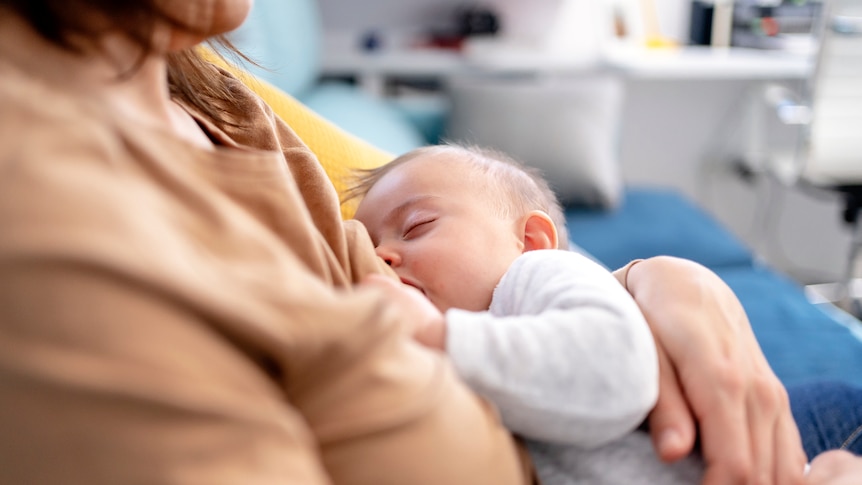 Mother breastfeeding her son.