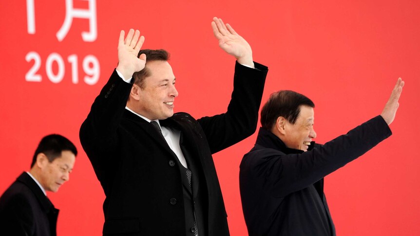 Elon Musk and Shanghai's mayor wave their arms around