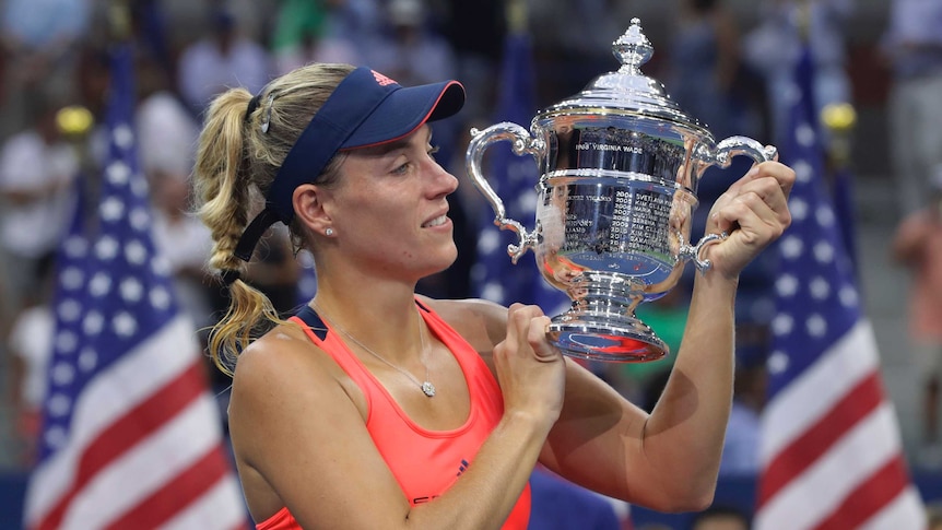 Germany's Angelique Kerber holds the US Open trophy after beating Karolina Pliskova in the final.