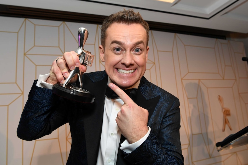 Grant Denyer poses with his Logie award for the most popular presenter