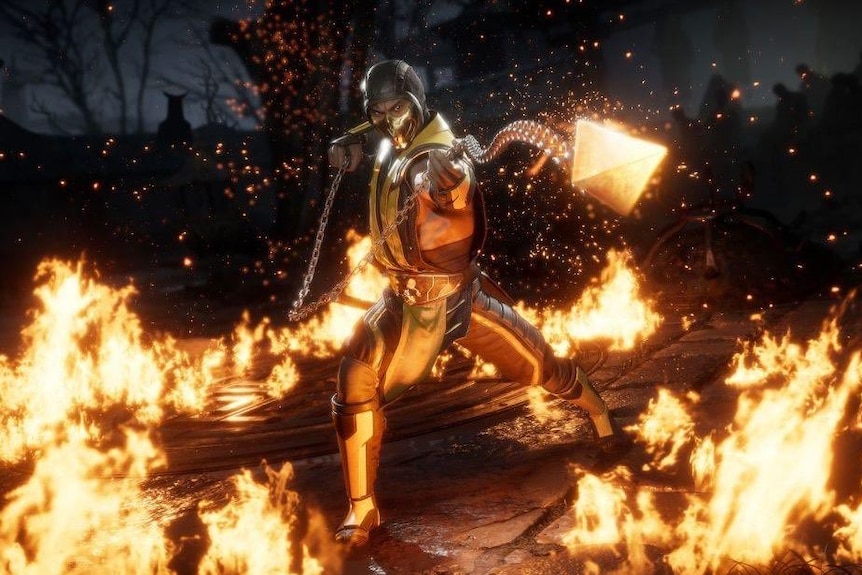 A video game character wearing a yellow outfit surrounded by fire on the ground