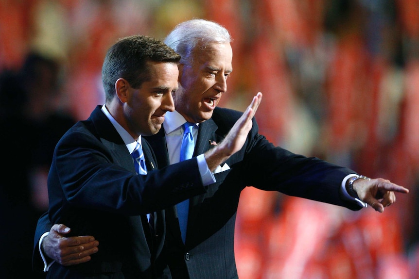 Joe Biden and his son Beau on stage.