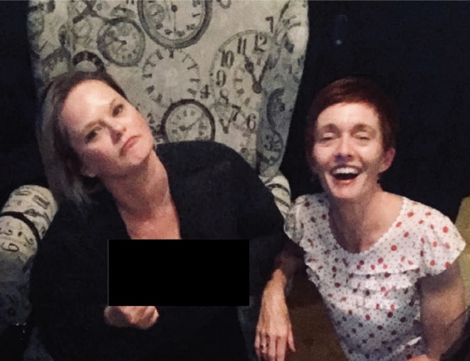 Roxanne and Gail joking around on a couch.