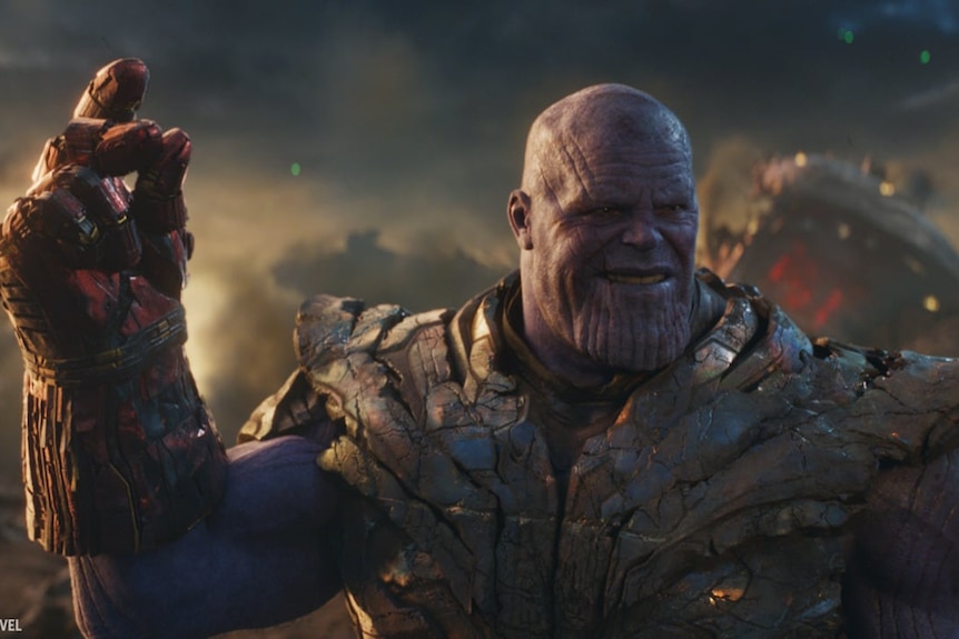 Thanos about to click to fingers wearing the Nano Gaunlet.