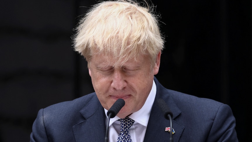 Boris Johnson closes his eyes outside No 10 Downing Street as he announces his resignation.