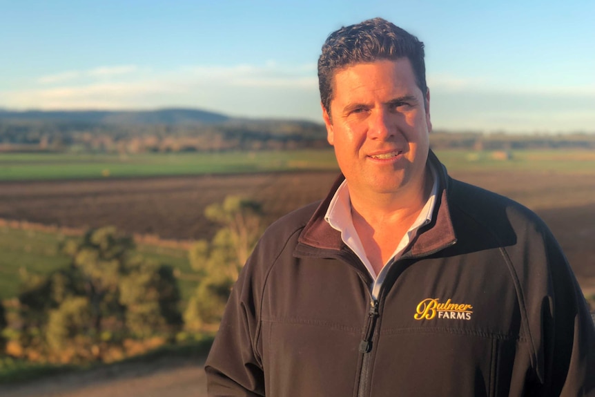 Andrew Bulmer, salad producer, standing in front of some of his fields